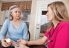 Mature Adult Woman Receiving Medication Instructions From Nurse.