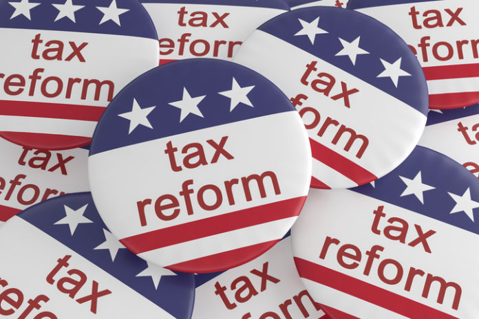 USA Politics News Badge: Pile of Tax Reform Buttons With US Flag