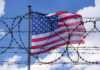 USA Border with American Flag and barbed Wire